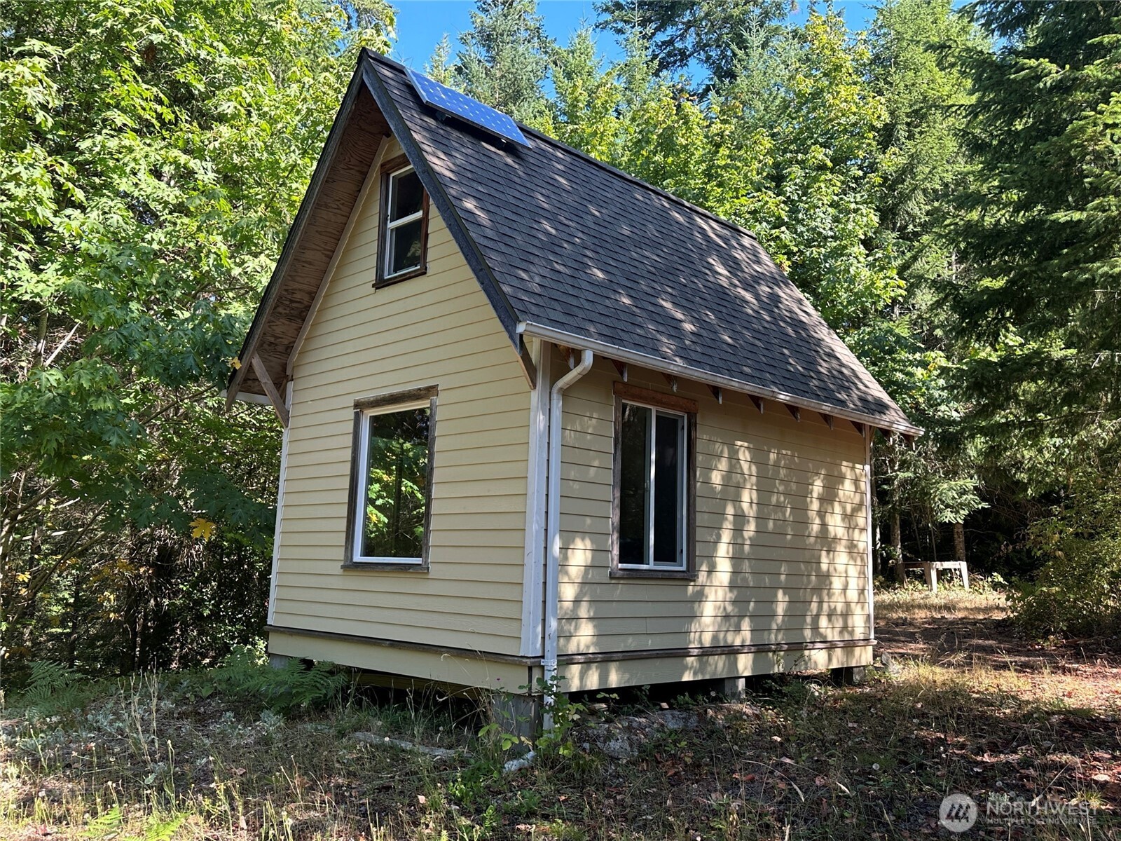 22222-nhn East Quilcene Road Quilcene, WA 98376 - Photo 10 of 39 a view of a house with a yard