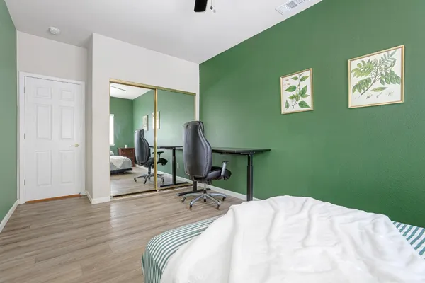 a bedroom with a bed and a table