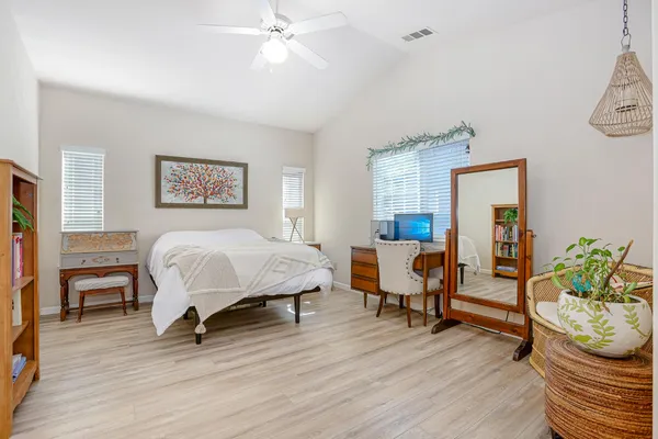 a bedroom with a bed and furniture