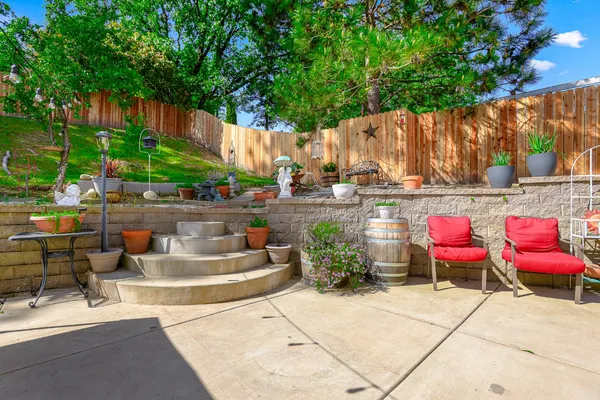 a view of a backyard with sitting area