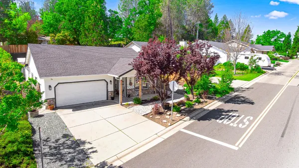 a backyard of a house with lots of green space