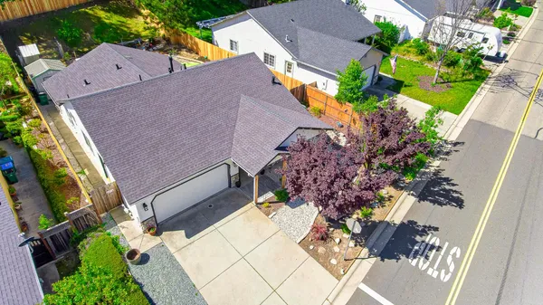 an aerial view of house with yard