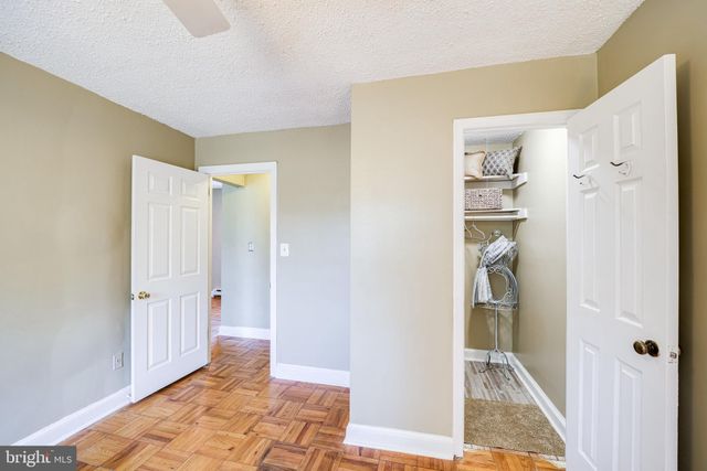 a room with a fireplace and cabinets