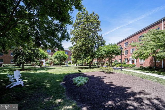 a front view of house with yard outdoor seating and green space