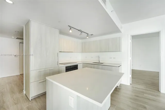 a view of a kitchen with electric appliances