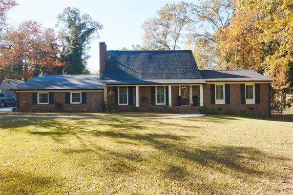 a front view of a house with a swimming pool
