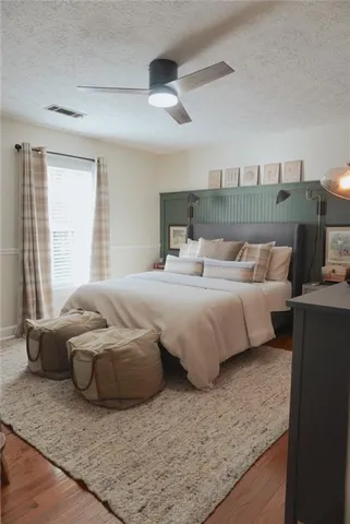 a bedroom with a bed and window