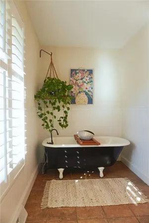 a room with a table and a potted plant