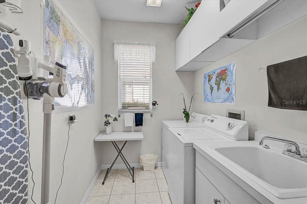 2115 Muskogee Trail Nokomis, FL 34275 - Photo 25 of 39 a bathroom with a sink and a large mirror