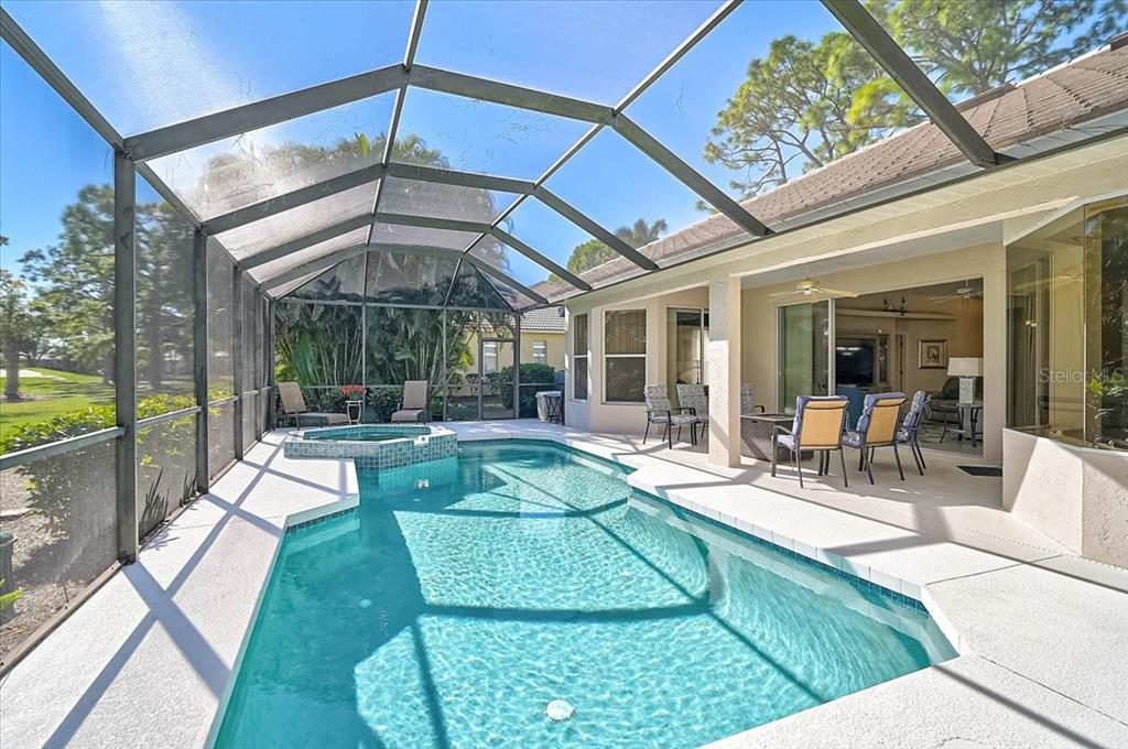 2115 Muskogee Trail Nokomis, FL 34275 - Photo 27 of 39 a view of a swimming pool with a patio