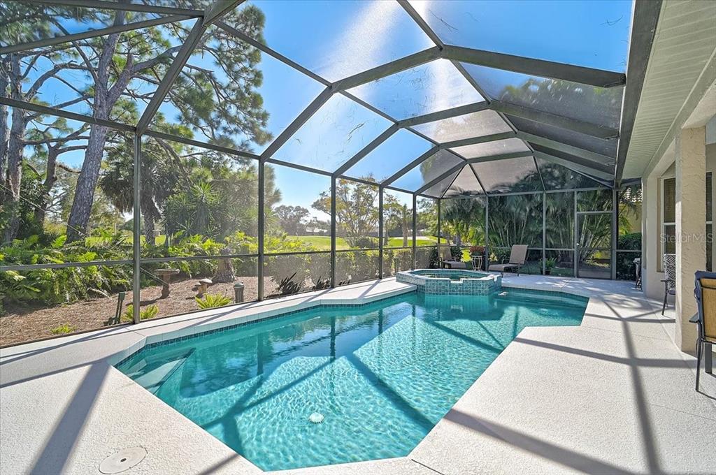 2115 Muskogee Trail Nokomis, FL 34275 - Photo 28 of 39 a view of a backyard with sitting area