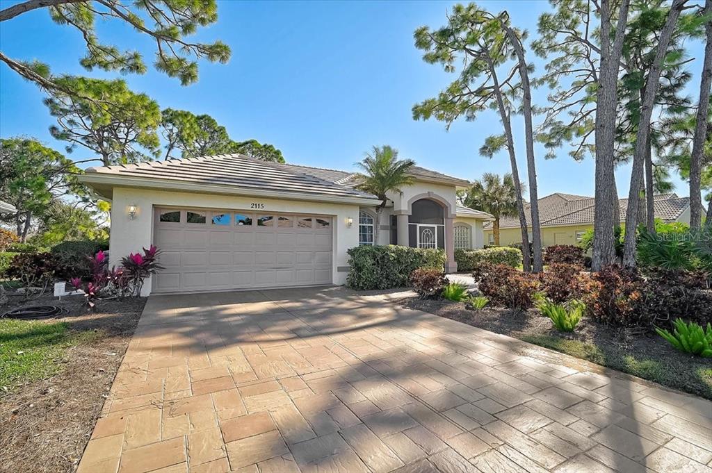 2115 Muskogee Trail Nokomis, FL 34275 - Photo 3 of 39 a view of a house with a garden