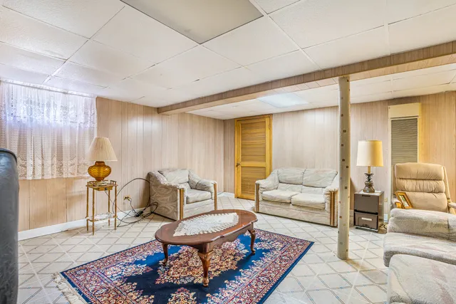 a living room with furniture and a table