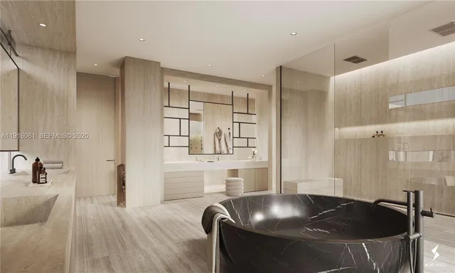 a kitchen with stainless steel appliances granite countertop a sink and a refrigerator