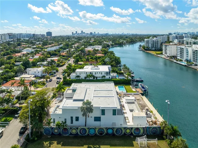 an aerial view of a house with a lake view