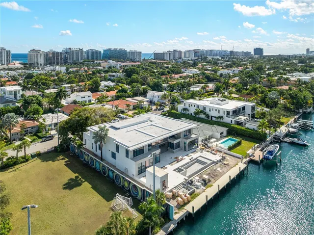 an aerial view of a house with a ocean view