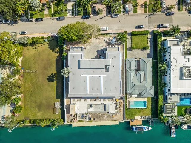 an aerial view of multiple houses with yard
