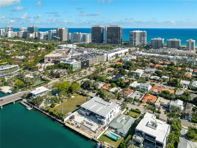 a view of a city with lots of residential buildings lake and ocean view