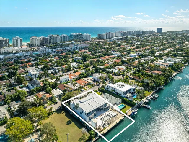an aerial view of residential houses with city view