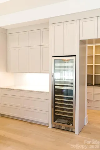 a view of an empty room with a chandelier
