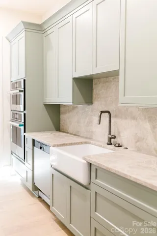 a bathroom with a sink and mirror