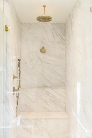a picture of a bathroom with a shower
