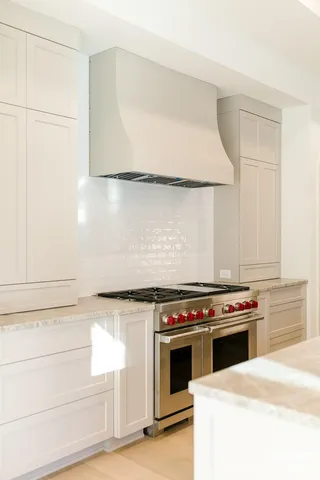 a kitchen with cabinets appliances and a sink
