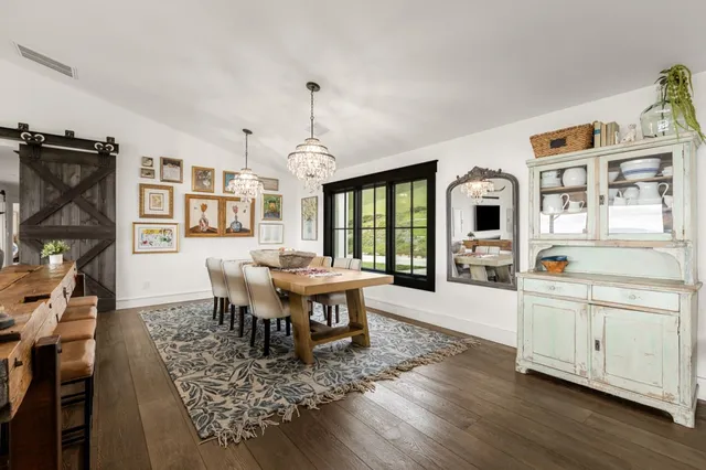 a spacious bathroom with a sink double vanity and a mirror