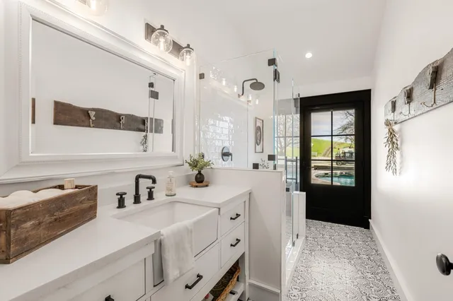 a view of a house with backyard space and wooden fence