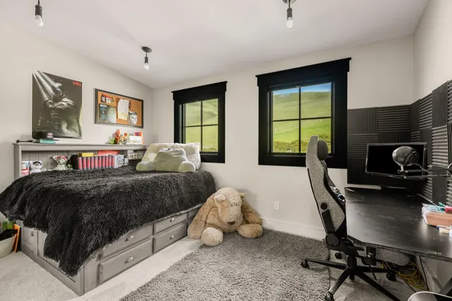 a living room with lots of furniture and clutter