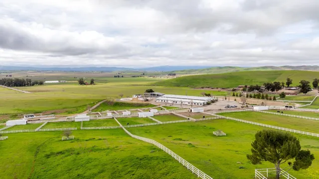 a view of a swimming pool and mountains in the background
