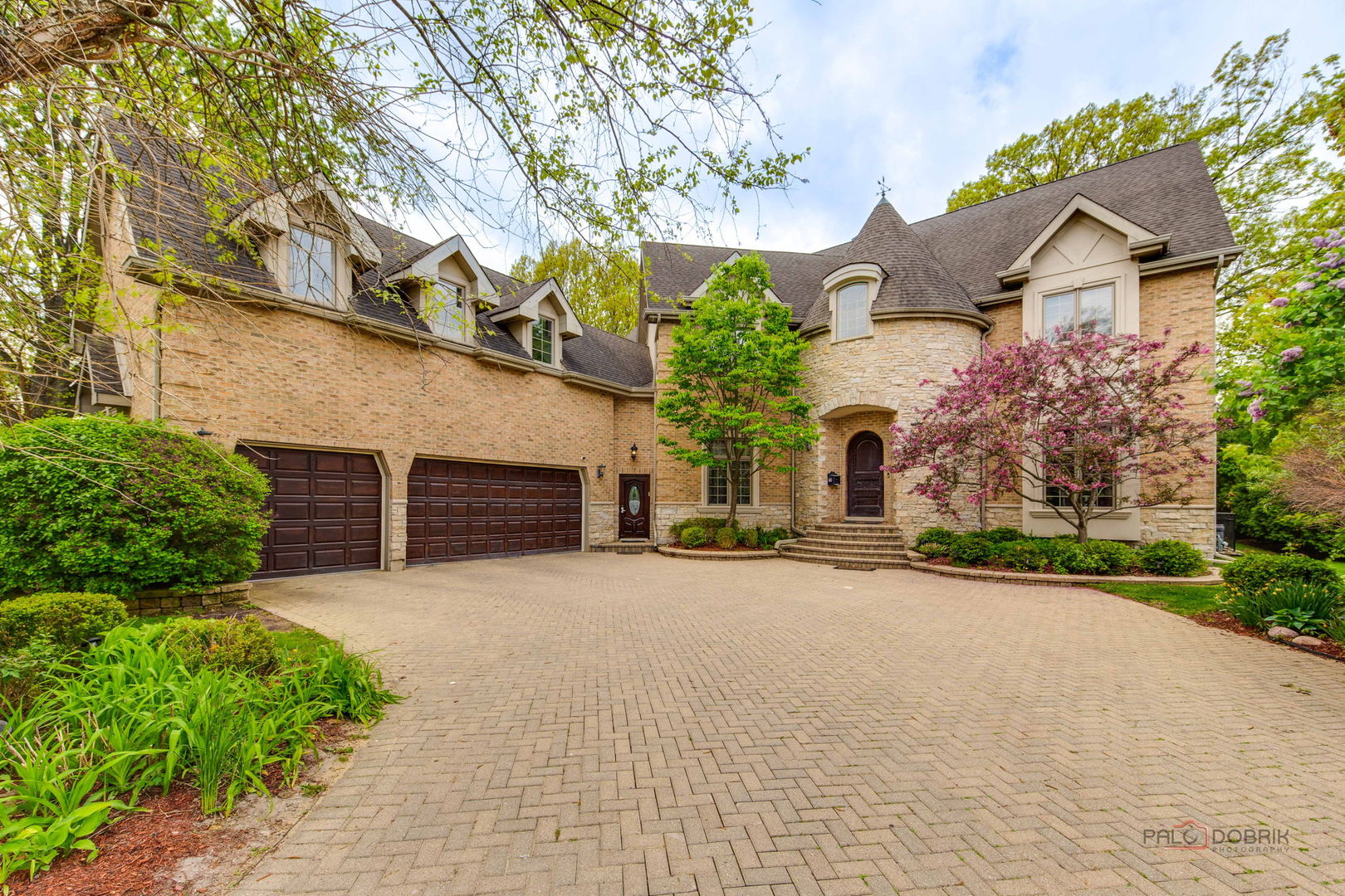300 Red Oak Road Northbrook, IL 60062 - Photo 1 of 40 front view of a house with a yard and a garage