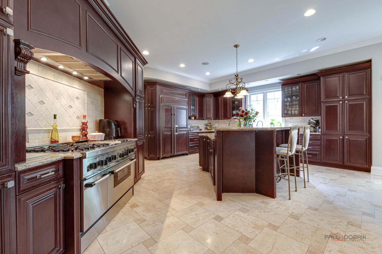 300 Red Oak Road Northbrook, IL 60062 - Photo 17 of 40 a kitchen with stainless steel appliances granite countertop a stove top oven a sink dishwasher a dining table and chairs