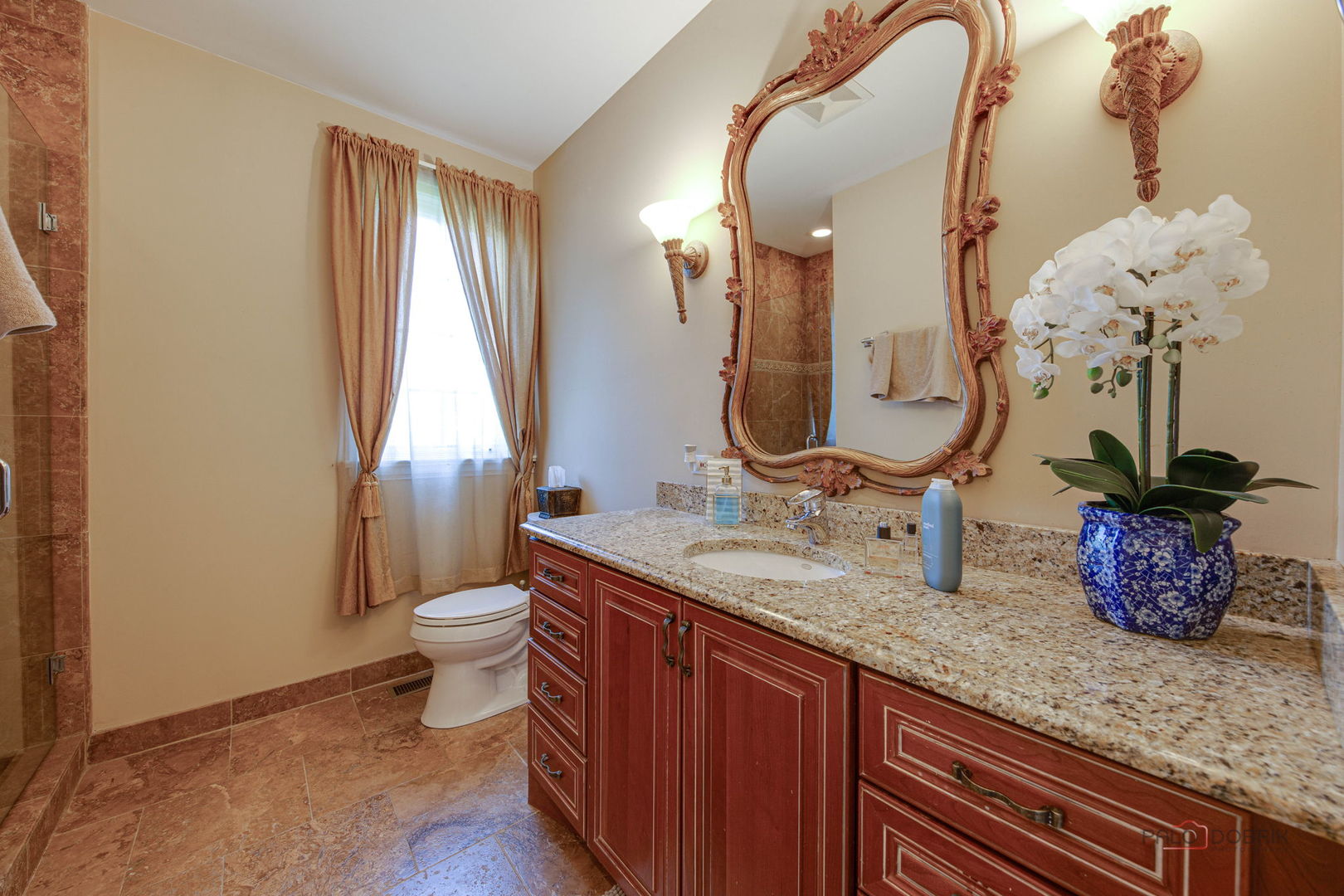 300 Red Oak Road Northbrook, IL 60062 - Photo 20 of 40 a bathroom with a granite countertop sink a toilet and a mirror