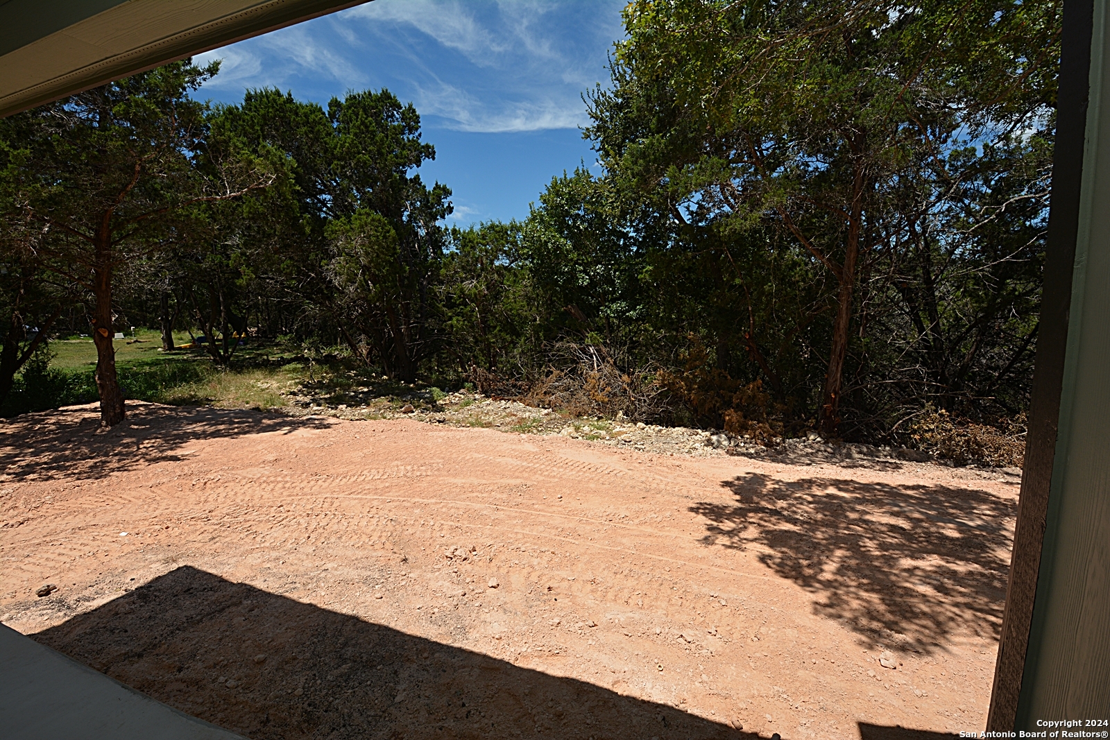 641 Turkey Canyon Drive Spring Branch, TX 78070 - Photo 11 of 11 a view of a yard with wooden fence