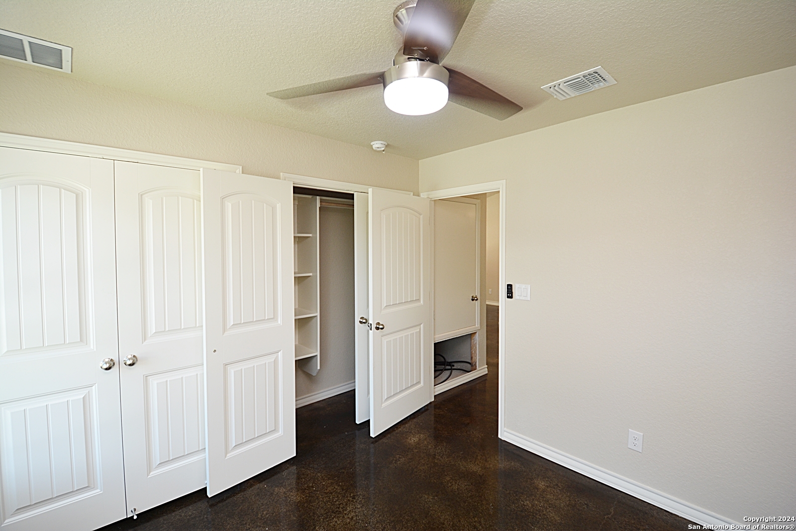 641 Turkey Canyon Drive Spring Branch, TX 78070 - Photo 7 of 11 wooden floor in an empty room with a window