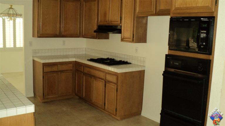 3114 Shale Road Palmdale, CA 93550 - Photo 8 of 13 a kitchen with a sink and cabinets