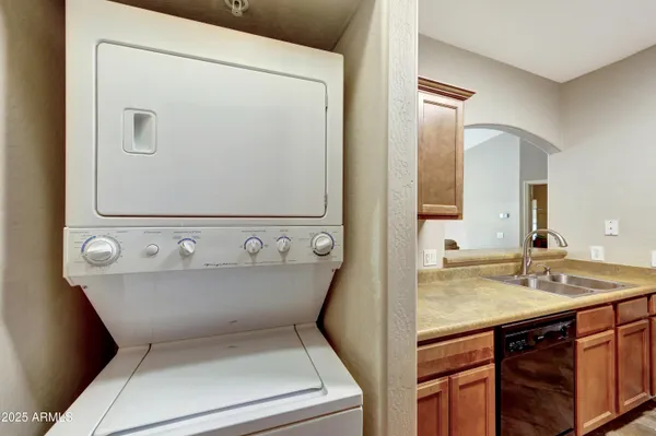 a view of bathroom with a sink and mirror