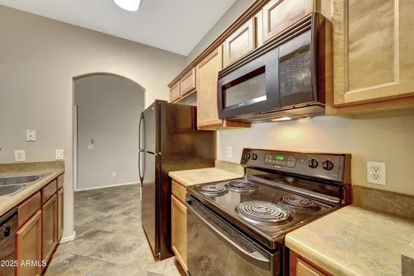 a kitchen with a stove and a microwave