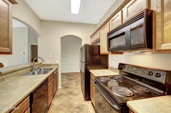 a kitchen with a stove and a microwave