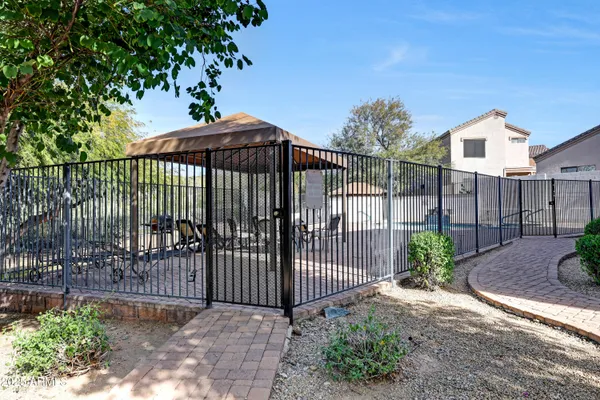 a view of a wrought iron fences in front of house