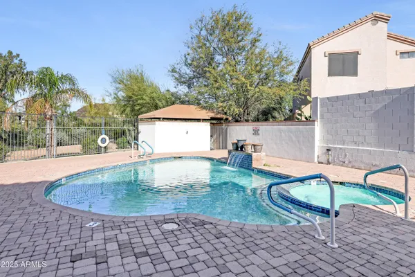 a view of a backyard with a sitting area