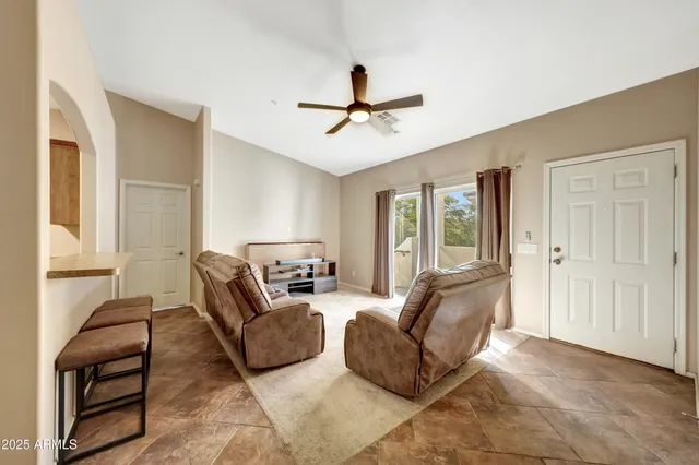 a living room with furniture and a window