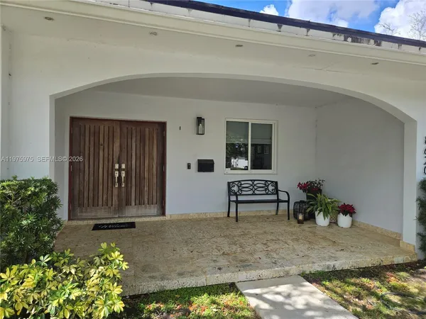 a view of a porch with seating space