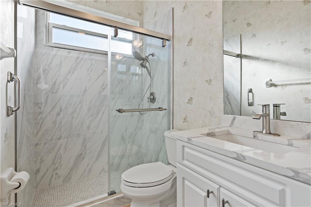 20751 Rivers Ford Estero, FL 33928 - Photo 11 of 36 Bathroom featuring vanity and a marble finish shower
