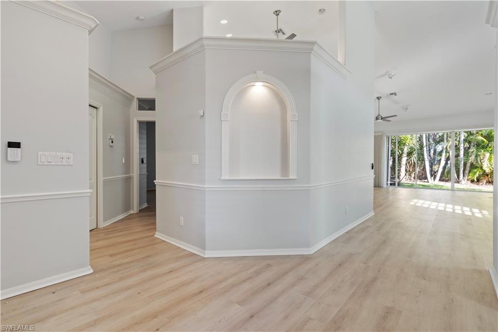 20751 Rivers Ford Estero, FL 33928 - Photo 18 of 36 Hall featuring light wood-style flooring and a high ceiling