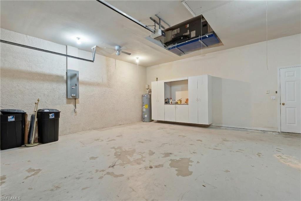 20751 Rivers Ford Estero, FL 33928 - Photo 29 of 36 Garage with electric panel, electric water heater, and ceiling fan