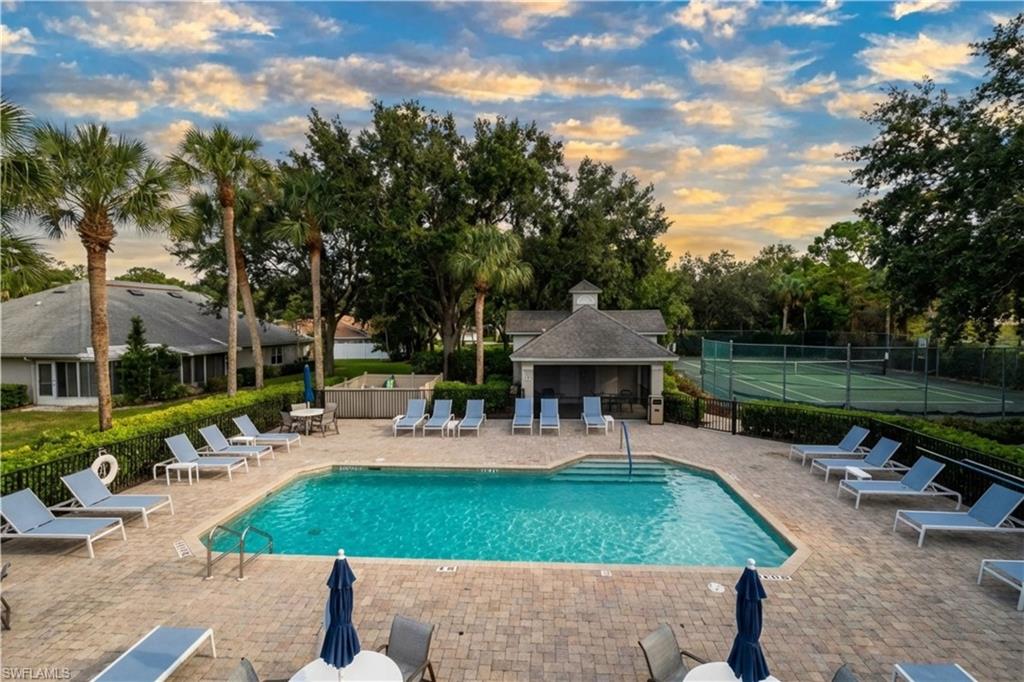 20751 Rivers Ford Estero, FL 33928 - Photo 34 of 36 Community pool with a patio and view of scattered trees