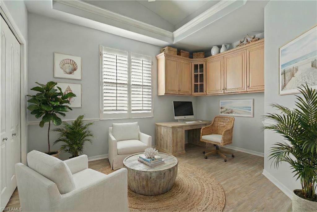 20751 Rivers Ford Estero, FL 33928 - Photo 10 of 36 Home office featuring vaulted ceiling, built in desk, and light wood-style floors