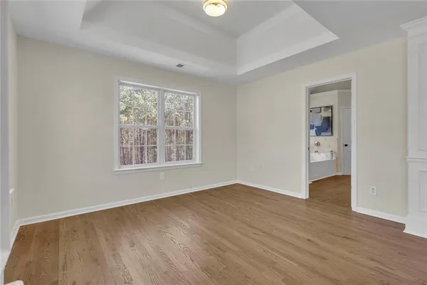 a view of an empty room with windows